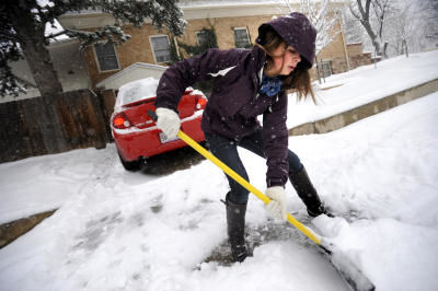 SNOW4.JPG SNOW4.jpg Katherine Karubus works to clear a path out her driveway on University HIll in Boulder as she heads to work on Thursday morning.  Photo by Paul Aiken The Camera