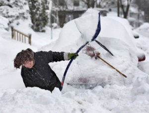 Arleen Shulman digs her car out on Coover Street in Mechancsburg Saturday morning. A heavy accumulation of snow blanketed the midstate with totals measuring between 16 and 20 inches. JOE HERMITT, The Patriot-News